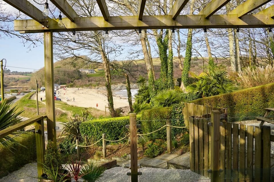 Garden views towards Maenporth Beach from Avalon Beach House Forever Cornwall