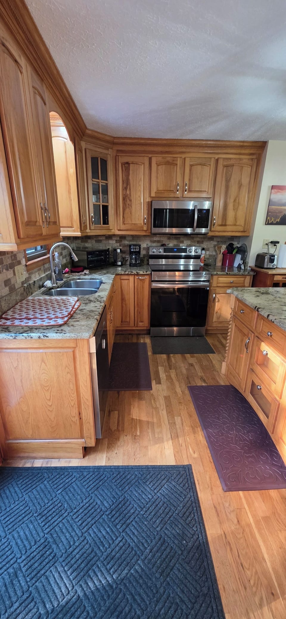 Granite countertops, beautiful custom cabinets, new appliances, fully stocked