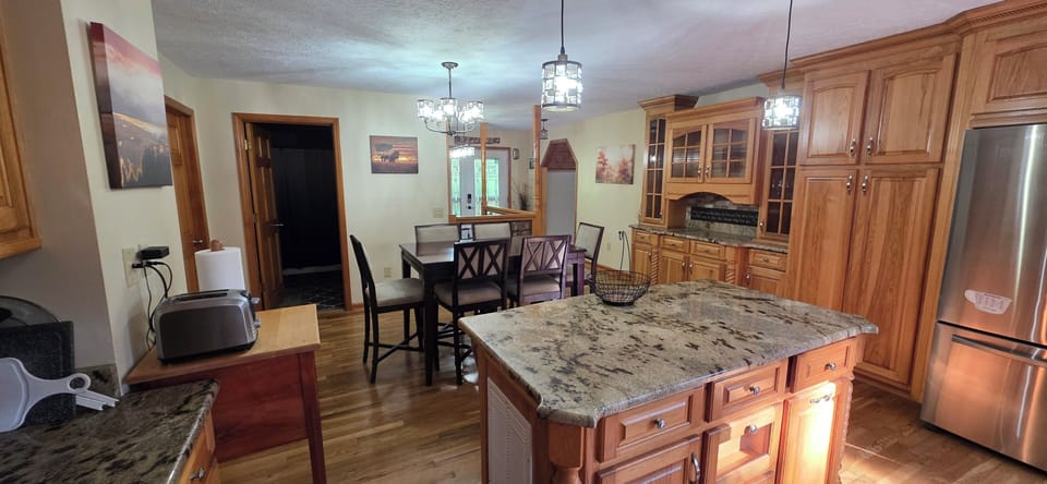 Granite countertops, beautiful custom cabinets, new appliances, fully stocked