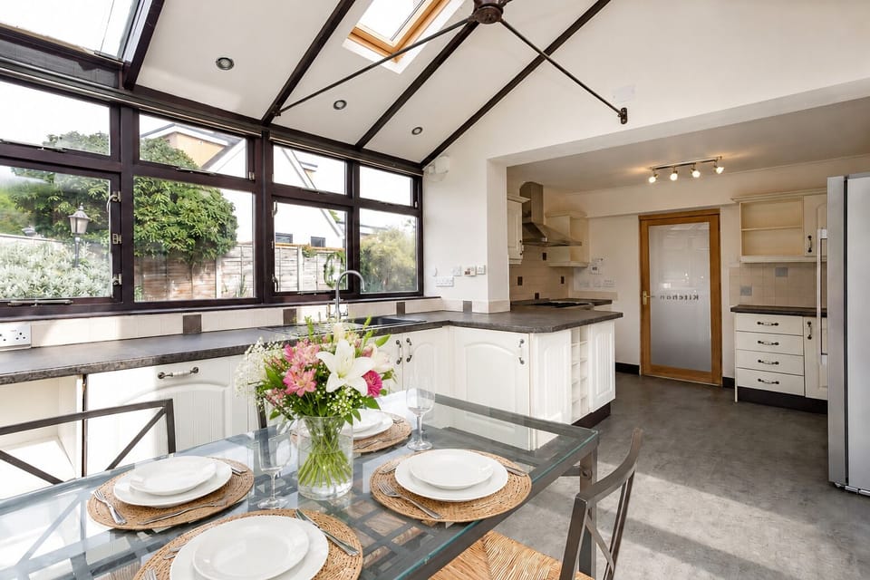 Relax with morning coffee & breakfast dining in unique kitchen conservatory.