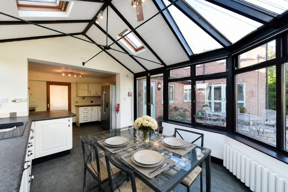 Morning coffee & breakfast dining in boutique kitchen conservatory.