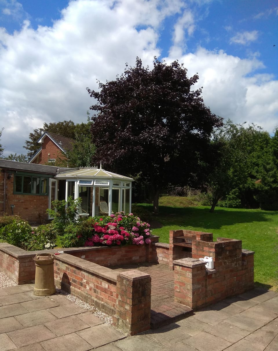 Rear landscaped garden area.