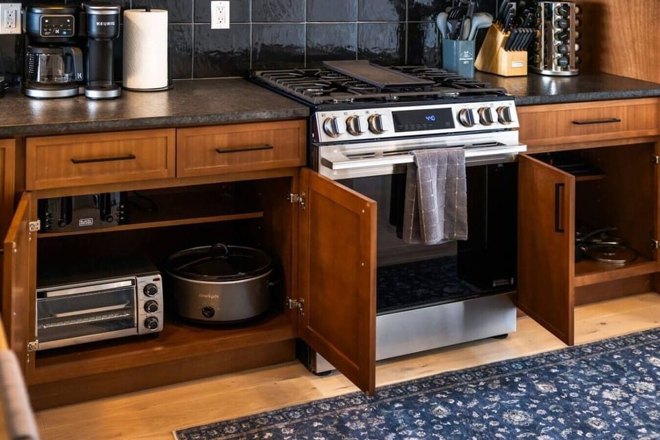 All the comforts of home right at your fingertips—featuring premium small appliances tucked away in beautiful custom cabinetry.