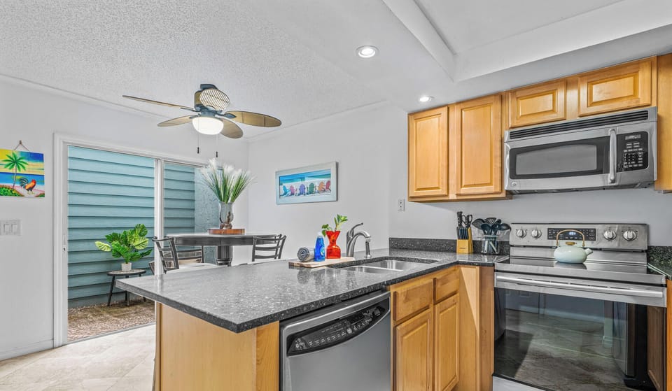 Fully-Equipped Stainless Steel Kitchen with Bar Seating
