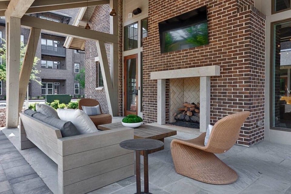 Relax and socialize in the shared outdoor lounge with a fireplace and Smart TV.