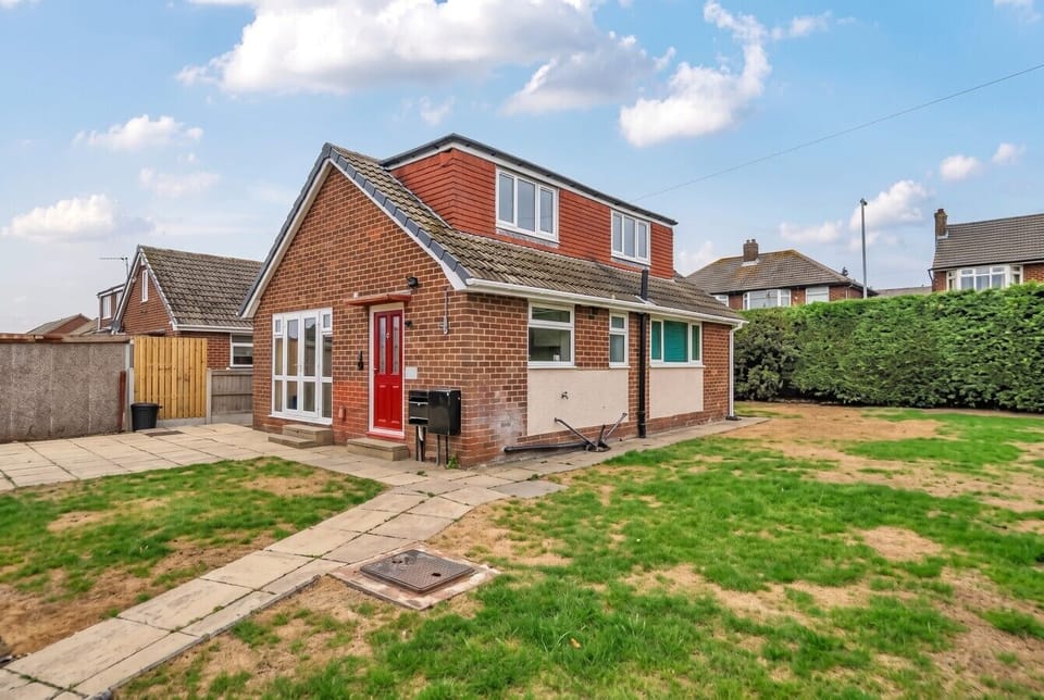 Arrive home to a detached house with wraparound garden and parking