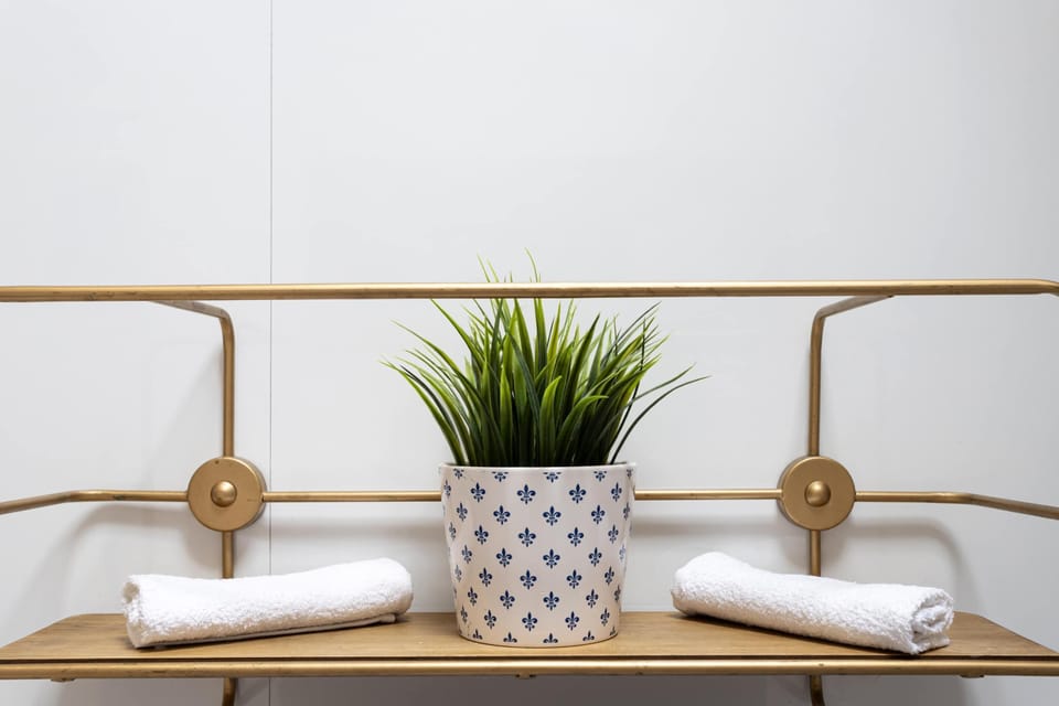 Fresh towels and useful storage are ready for your stay, adding the simple comforts that make unpacking, getting ready and settling in that little bit easier.