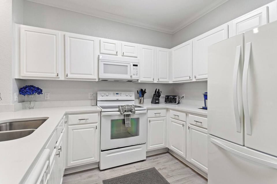 Enjoy a fresh cup anytime with the convenient Keurig coffee maker. This fully equipped kitchen includes modern appliances, plenty of counter space, and everything you need for a comfortable stay.