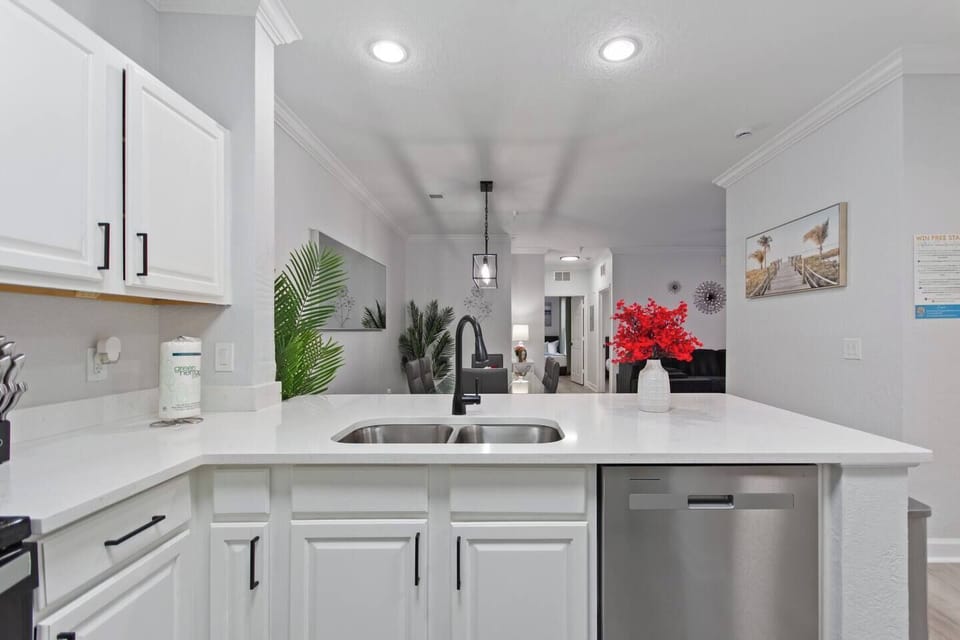 Modern kitchen island with sleek countertops and comfy bar stools—perfect for casual meals, morning coffee, or chatting while cooking. Stylish, functional, and designed for together time.