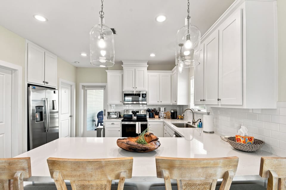 Bright modern kitchen with spacious island seating and sleek finishes