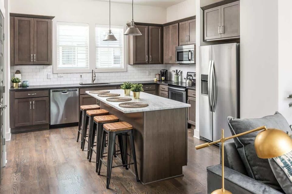 Plenty of counter space and storage for grocery hauls, with a full-size stainless fridge for the group's snacks.