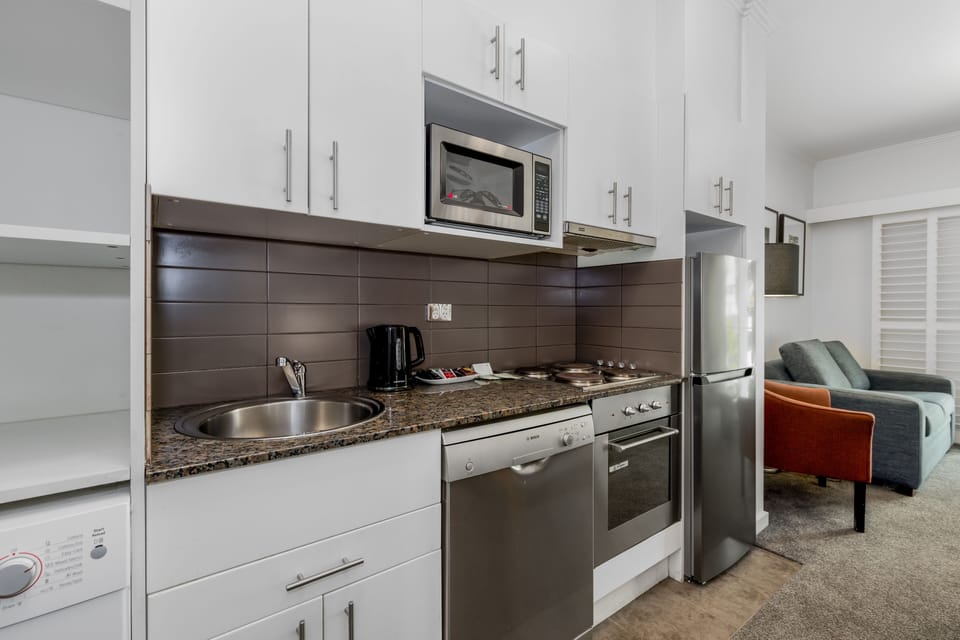 Deluxe Two Bedroom Apartment | Private kitchenette | Fridge, coffee/tea maker, electric kettle