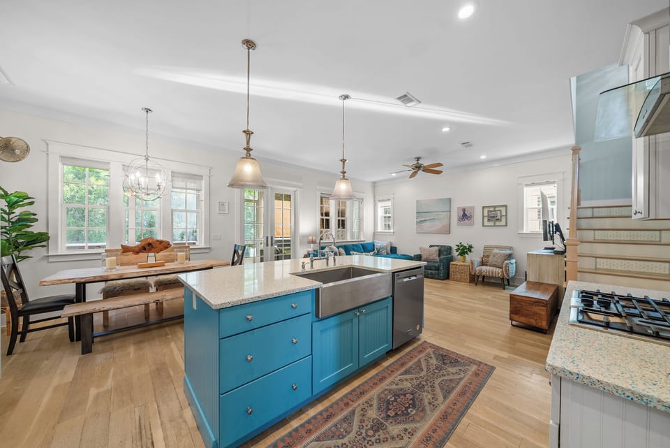 Kitchen, dining, and living all open to one another, so whoever is cooking is still part of the conversation.