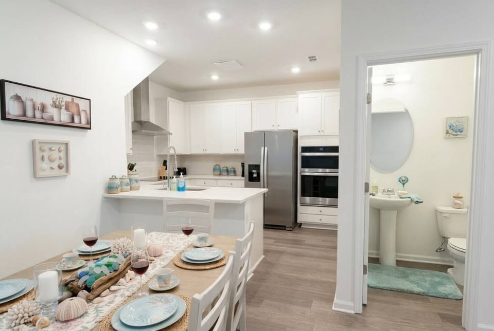 Cook like a local with a fully stocked, modern kitchen featuring stainless steel appliances, double ovens, and generous counter space — everything a home chef needs.