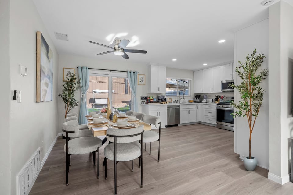 Gather around the dining table in this bright, spacious open layout.