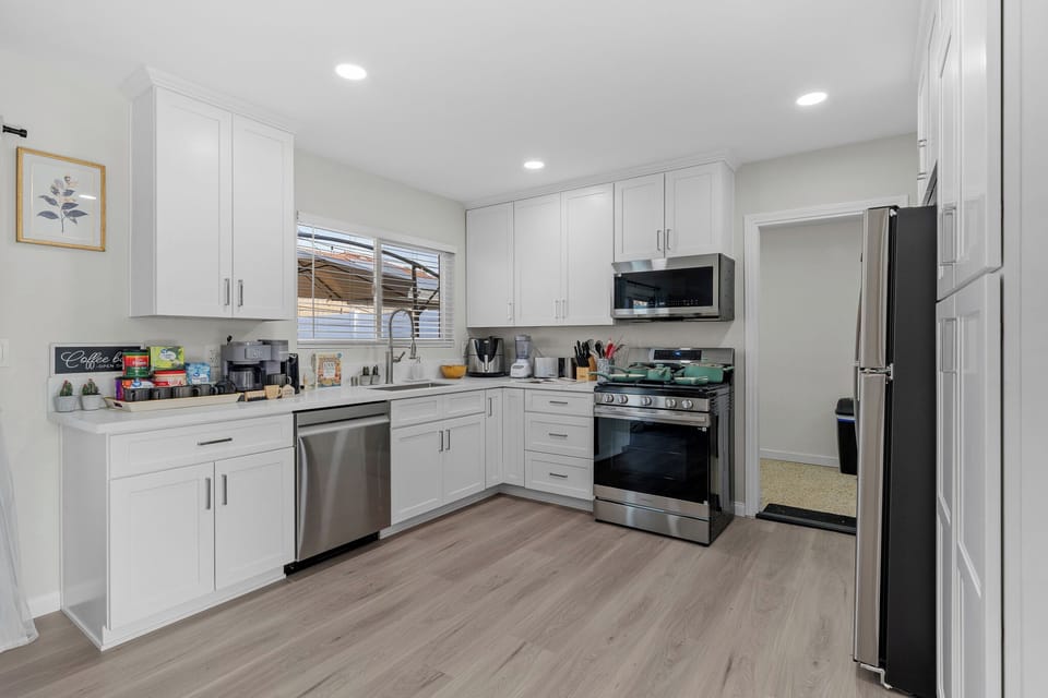Modern kitchen with ample counter space and everything needed to cook.
