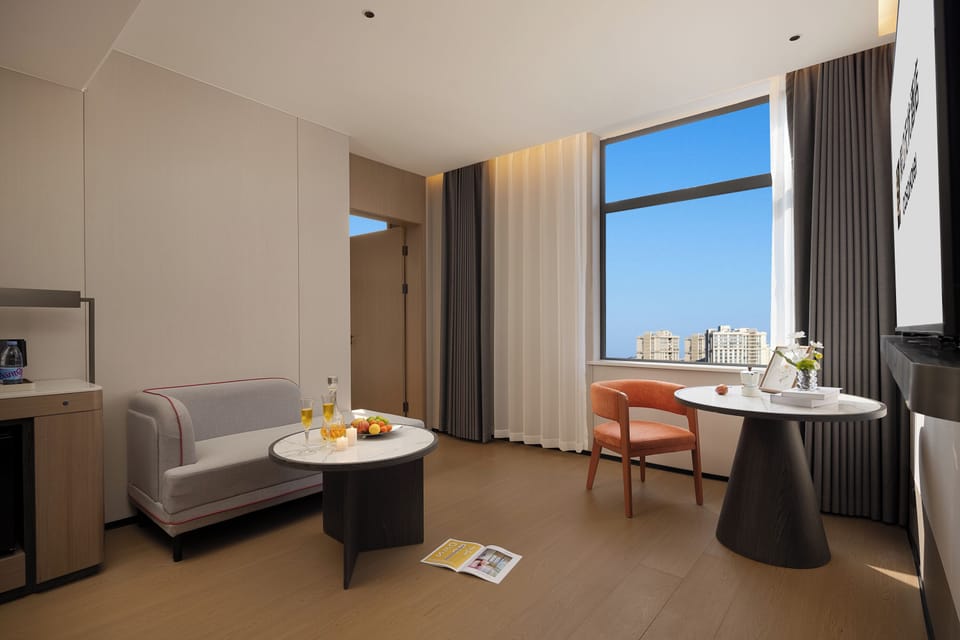 Executive Suite, City View | Living area | 70-inch LED TV with cable channels