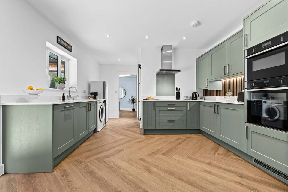 The fully equipped kitchen at Blue Puffin Stays make it easy to enjoy a home-cooked meal with family plus a ready-to-use washing machine for added convenience in doing your laundry