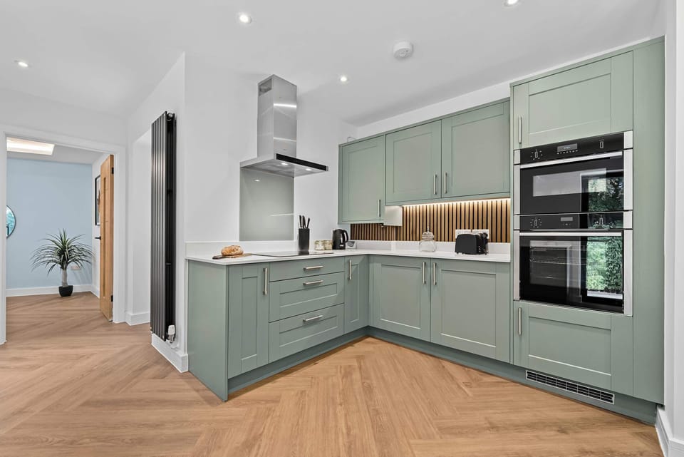 The fully equipped kitchen at Blue Puffin Stays make it easy to enjoy a home-cooked meal with family plus a ready-to-use washing machine for added convenience in doing your laundry