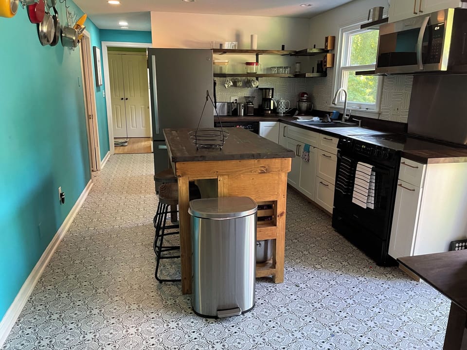 Long view of the kitchen into the main bedroom. 