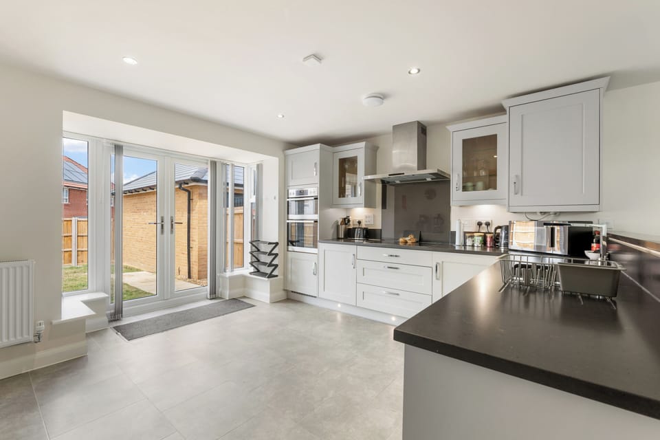 Step into a modern, well equipped kitchen with plenty of worktop space and an integrated oven and hob, perfect for whipping up your own home cooked meals during your stay. Throw open the French doors and let the garden become part of the space.