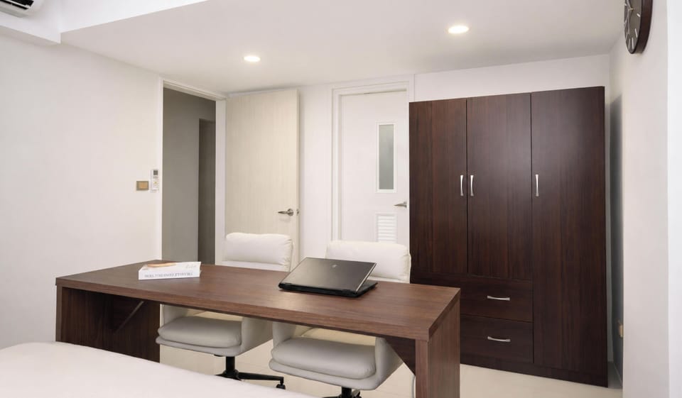 Bedroom 1 (Ensuite):  • King Bed  • Double Desk & Office Chairs • Closet • Private Bathroom
