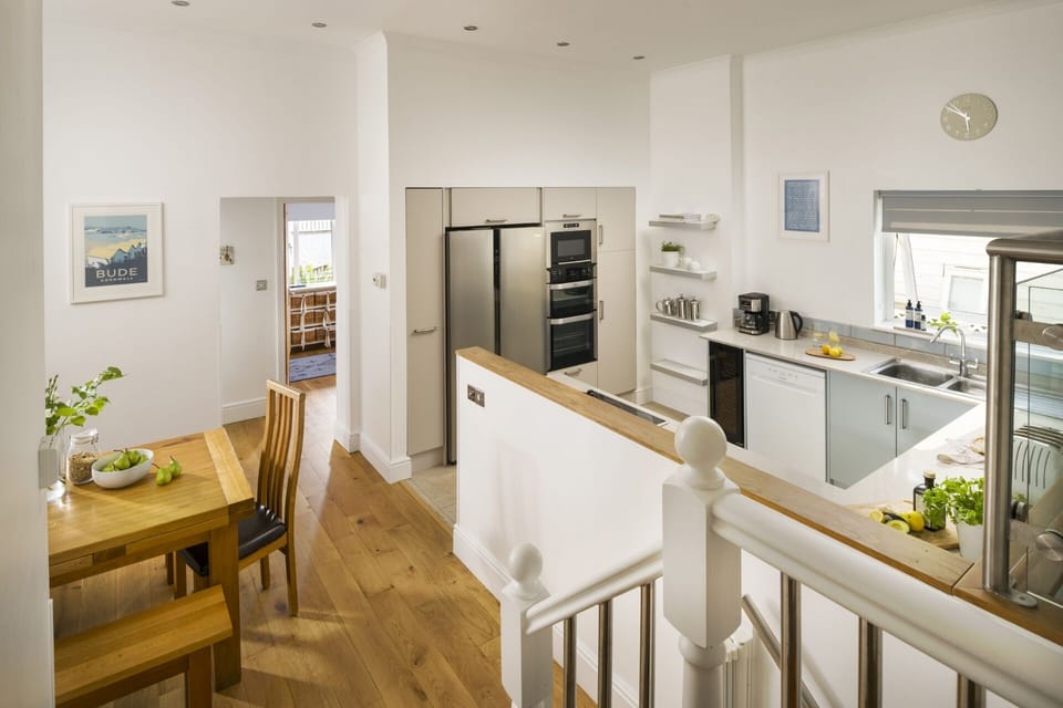 Open plan kitchen with family space at Croft House Widemouth Bay