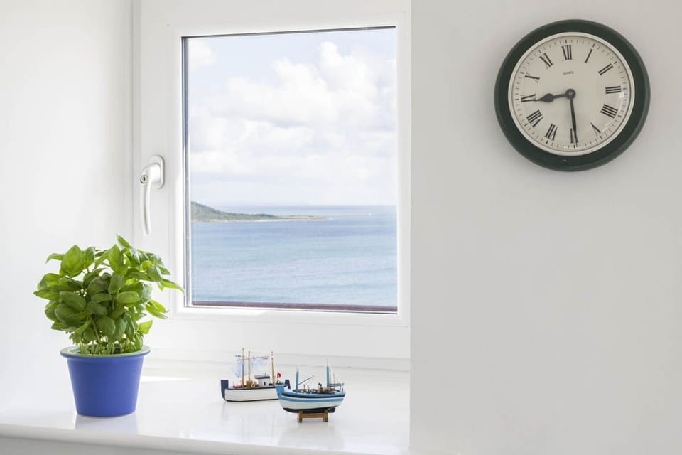 Window views across the coastline at Epic View Coverack