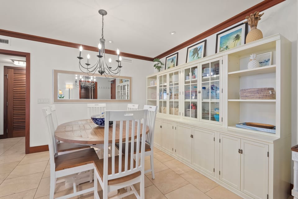 Linger over breakfast in the bright corner, white built-ins lining the wall behind the table.