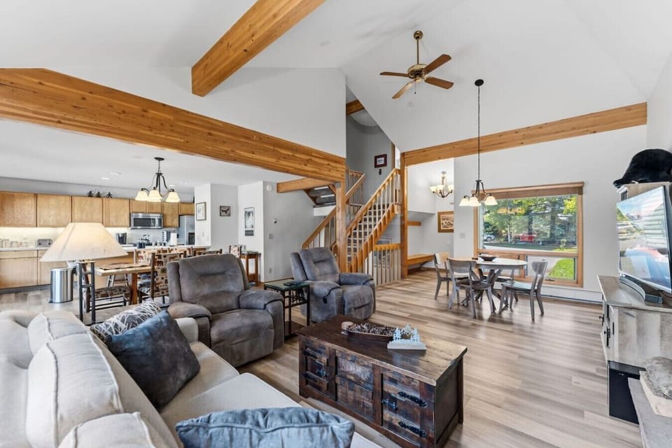Cozy living area with wood-burning fireplace and smart TV