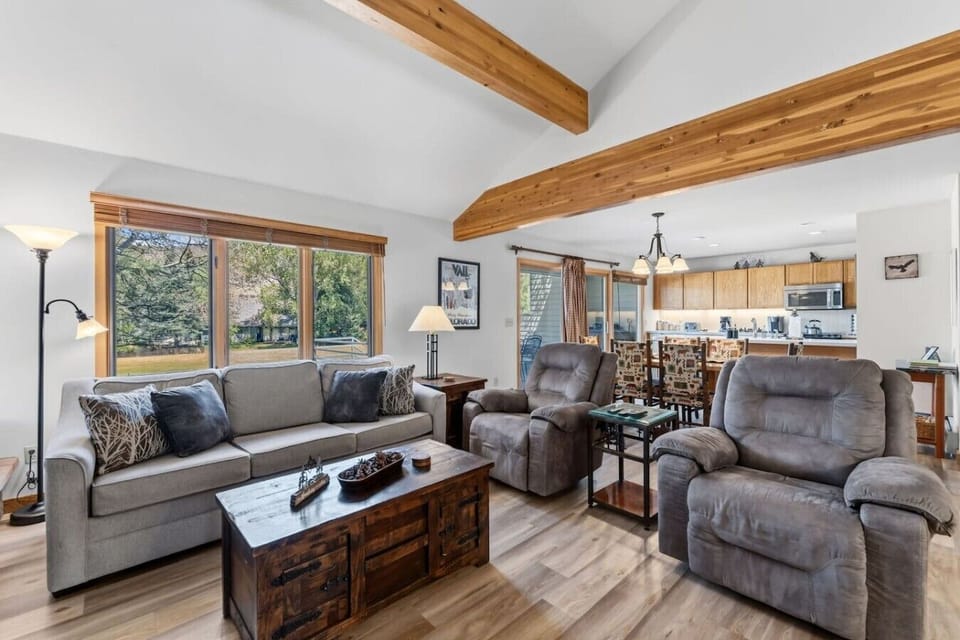 Cozy living area with wood-burning fireplace and smart TV
