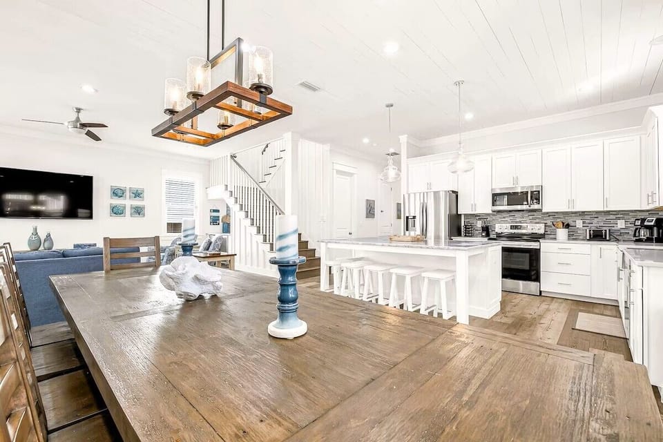 Gourmet Kitchen: Fully stocked gourmet kitchen equipped with high-end stainless steel appliances, custom quartz countertops, a double-basin farmhouse sink, tile backsplash, and all essential cookware for your group.