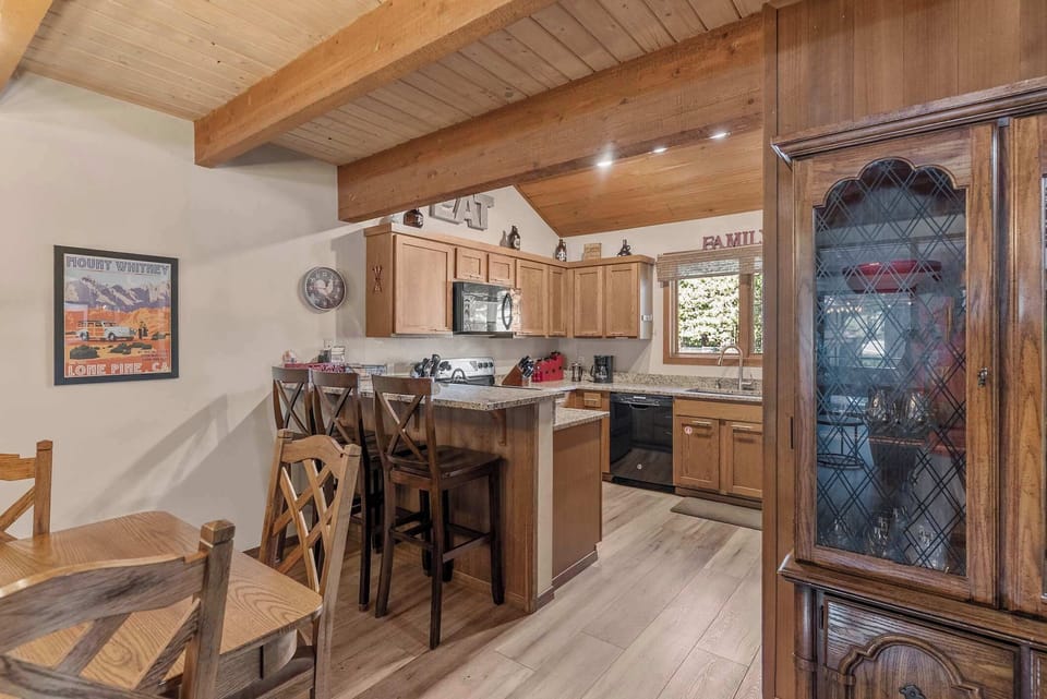 Open dining and kitchen with vaulted ceilings