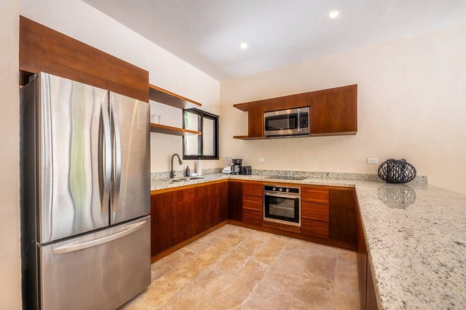 Prepare everything from breakfast to dinner in this fully equipped kitchen with modern appliances and plenty of space.