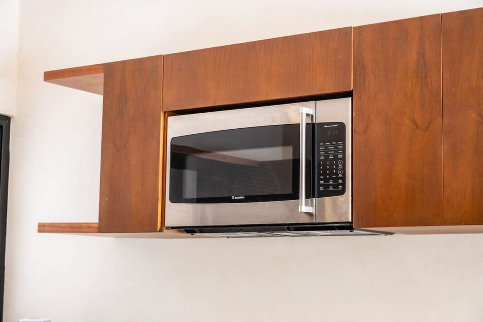 Heat up quick meals or snacks with the convenient built-in microwave in your fully equipped kitchen.