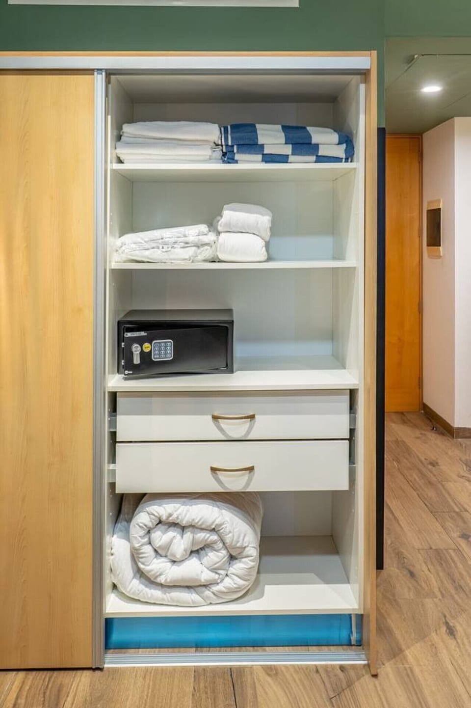 Spacious closet with a secure in-room safe, fresh linens, extra towels, and everything you need for a comfortable stay.