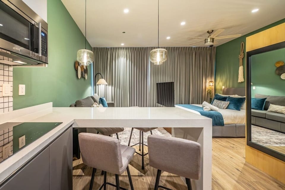 Bright open-concept studio featuring stylish décor, comfortable furnishings, and a welcoming atmosphere.