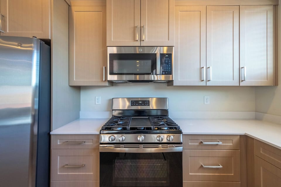 Meal prep is made easy with the spacious kitchen and stocked appliances