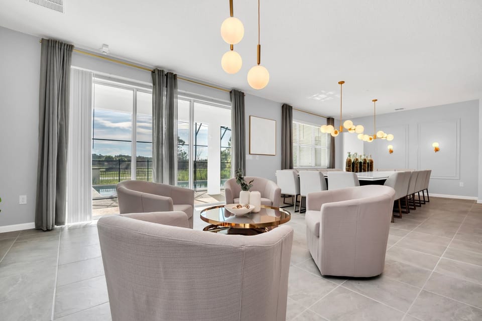 Elegant dining area with ample seating and stunning outdoor views, perfect for hosting large gatherings.