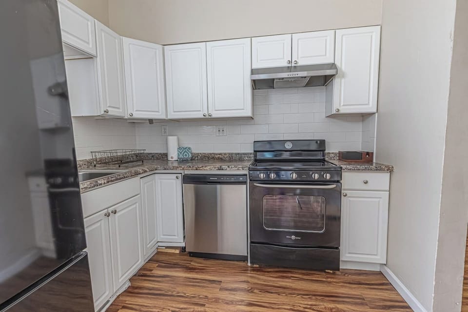 Bright kitchen with ample counter space and full-size appliances.