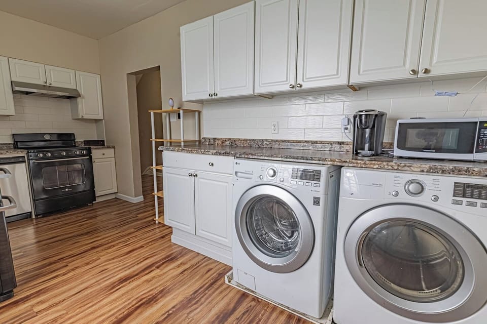 Convenient in-unit laundry area with a washer and dryer, perfect for longer stays or packing light.