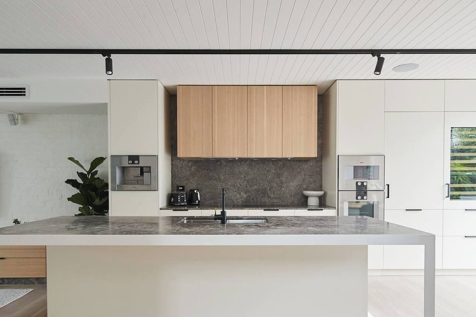 Cook with ease in the fully equipped kitchen, featuring an oven, stove, microwave, dishwasher, fridge, rice maker, French press, and all the essentials for effortless dining at home.