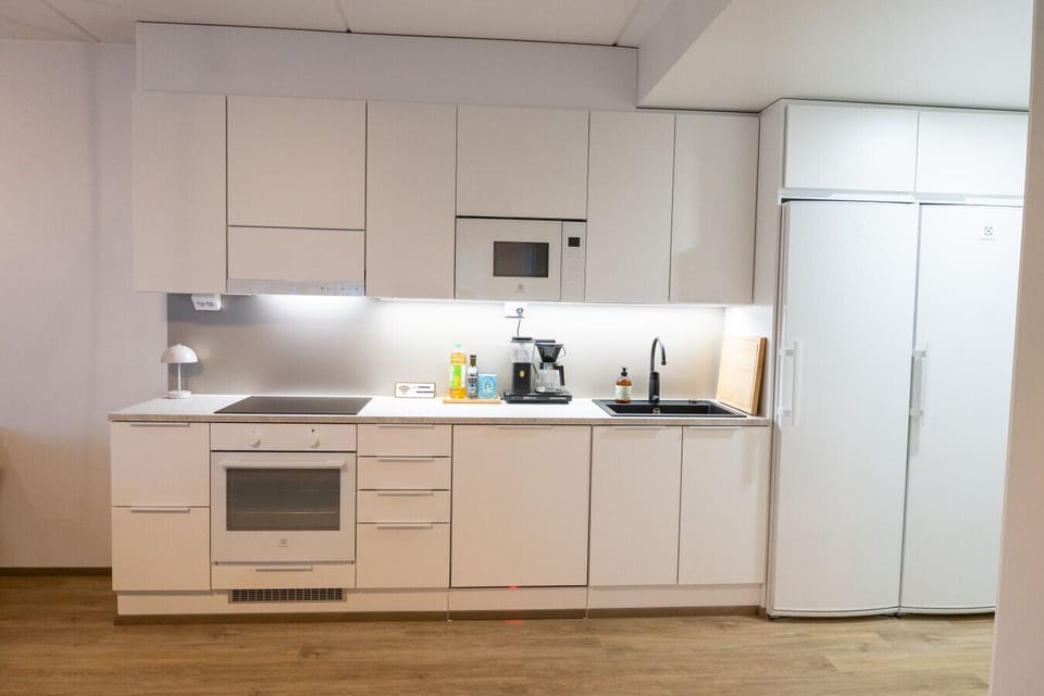 The kitchen has induction hob, oven, microwave and large fridge and freezer