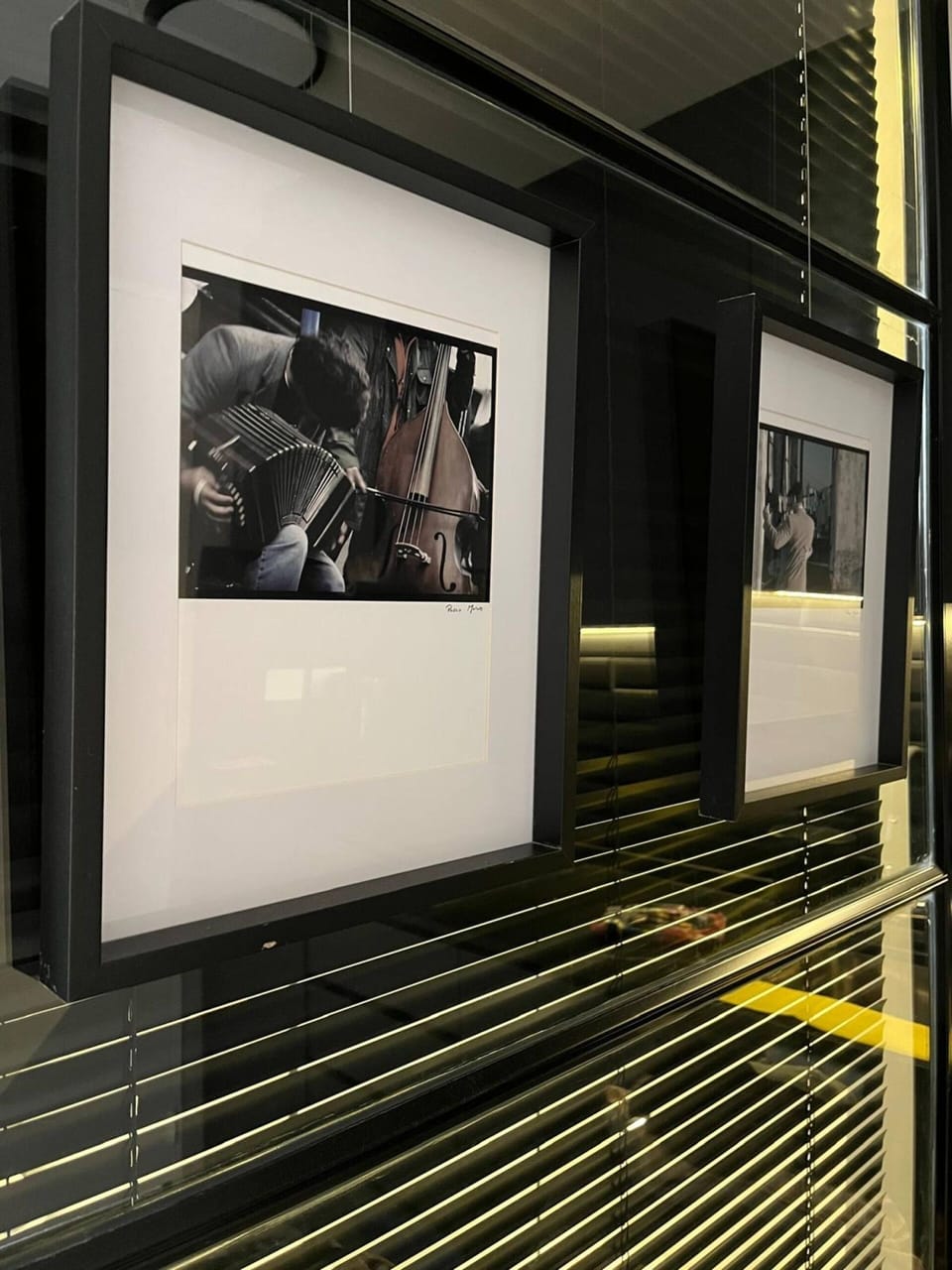Framed photos on glass divider