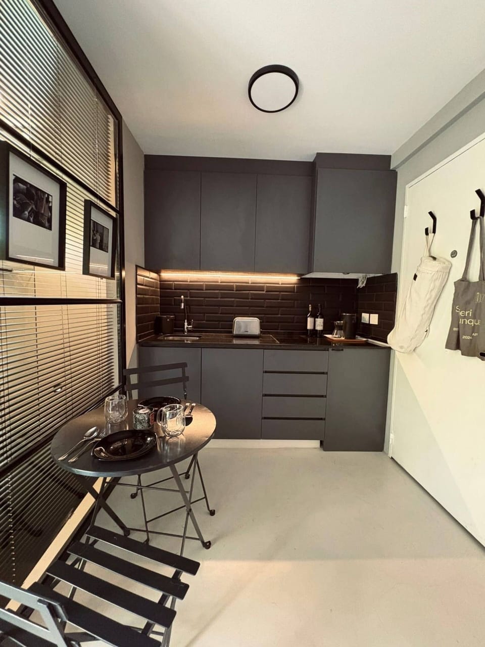 Compact kitchenette with dining set