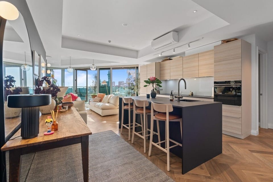 Open-plan kitchen designed to keep cooking and conversation together