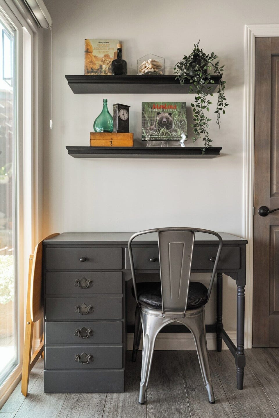 Living Room 2 | A tucked-away desk nook with industrial styling and floating shelves. A quiet corner to catch up on emails or plan the day ahead.