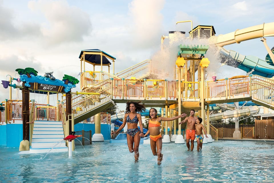 Twisting slides drop into the water park pools, built for family fun.