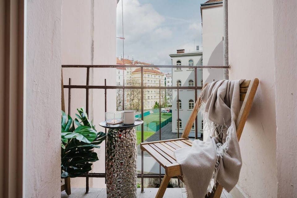 Small but charming balcony overlooking the courtyard — perfect for a morning coffee or an evening glass of wine.