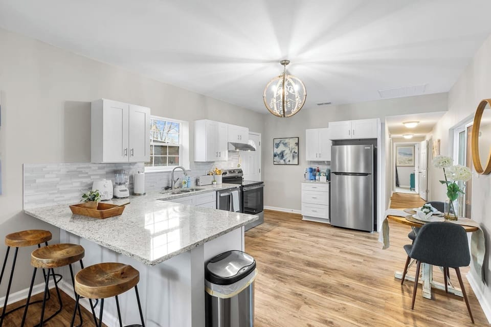 Fully stocked chef’s kitchen ready for large groups! Features stainless steel appliances, tons of counter space, and all the cookware needed for family meals. A modern kitchen designed for extended stays and foodies.